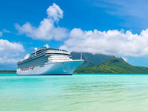 Cruise ship docked on beach in Bora Bora